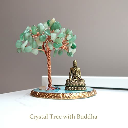 A crystal tree with Buddha statue on a decorative base, perfect for meditation and home decor.