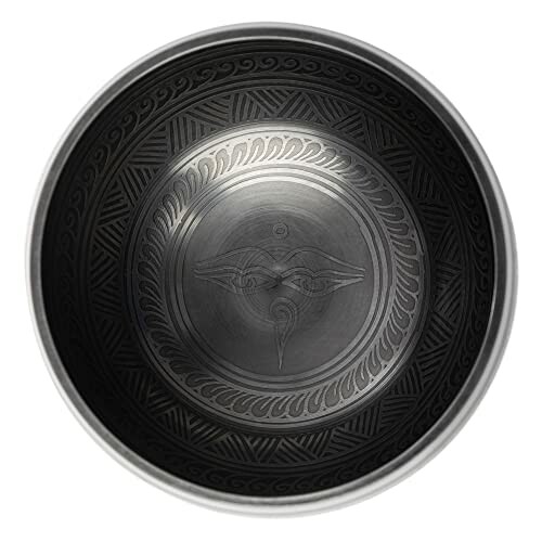 Intricately designed Tibetan singing bowl with patterns and symbols