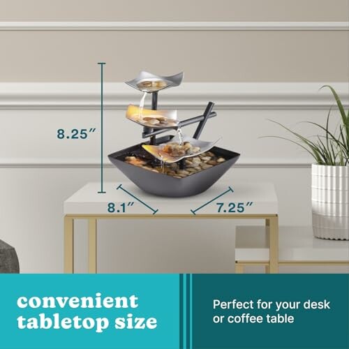 Tabletop water fountain with dimensions on a table.